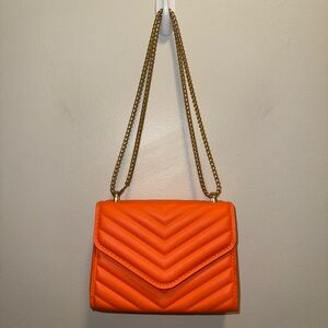 Chic Orange Quilted Crossbody Bag with Gold Chain